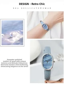 Macro view of oval pearl dial with crystal markers and blue leather strap detail