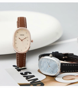 Detailed view of vintage oval quartz watches with leather straps and rhinestone markers