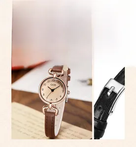 Detail of GEDI mini rose gold watch showing the slim leather strap and buckle close-up