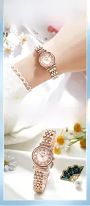 Detail of rose gold vintage watch with Roman dial and mother of pearl finish