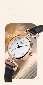 Close-up of GEDI women's watch featuring a sunray dial and rose gold case on a leather strap