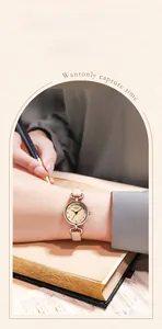 Detail of GEDI women's watch with zircon-encrusted gold bezel and slim leather strap