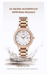 Detailed view of waterproof rose gold watch with crystal bezel and water splash effect