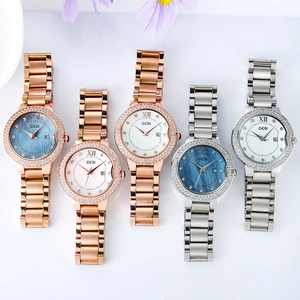 GEDI luxury women's steel watch with rhinestone bezel and seashell dial, date display