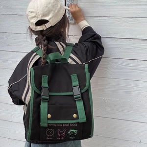 Retro canvas kids backpack with contrast trim and cute animal prints in black and green