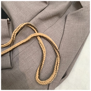 Detailed macro view of a dual-color woven cotton strap with a spiral texture