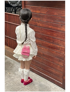 Pink tweed crossbody bag for girls with large leather bow and golden chain strap