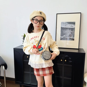 Cute girl's round shoulder bag with black and white woven pattern for kids casual wear