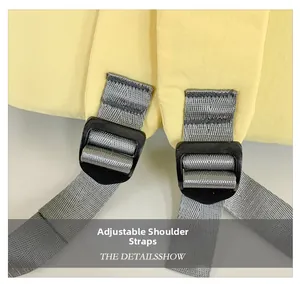 Detail view of yellow backpack featuring adjustable grey straps and black buckles