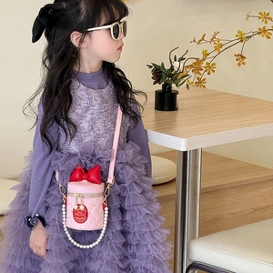 Pink quilted bucket bag for girls with red bow accent and elegant pearl chain handle