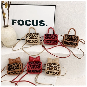 Various stylish leopard print mini handbags for kids with bows and leather handles