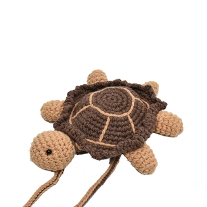 Handmade crochet turtle bag with brown geometric shell and crossbody woven strap