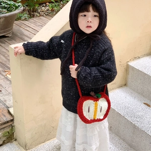 Handmade crochet apple-shaped crossbody bag for children with cute knitted design