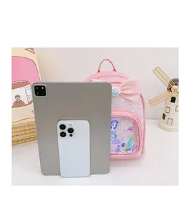 Pink sequin girls backpack with mermaid pattern and bow compared to tablet size