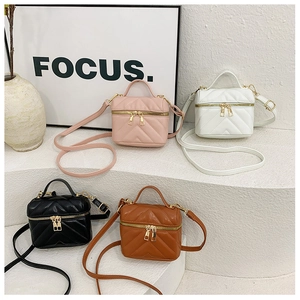 Mini quilted cross-body bags in four colors with V-pattern stitching and gold zippers