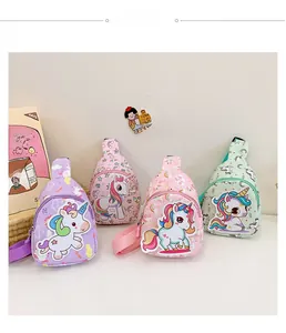 Detailansicht der Kinder-Einhorn-Brusttaschen in den Farben Lila, Rosa und Minzgrün