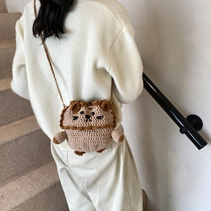 Handmade crochet lion bucket bag for kids with cute woven strap on white background