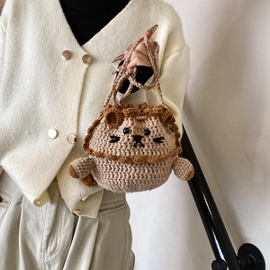 Handmade crochet lion bucket bag for kids with cute woven handles and 3D ears
