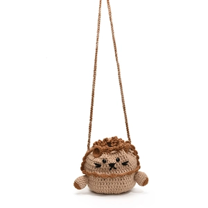 Handmade crochet lion bucket bag for kids with cute knit details and shoulder strap