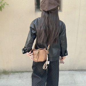 Fashionable brown leather mini bucket bag for girls with adjustable strap and retro design