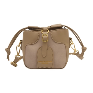 Mini color-block bucket crossbody bag for girls featuring drawstring closure and khaki leather
