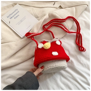 Detailed close-up of handmade crochet mushroom bucket bag with soft knitted texture