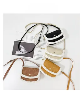 Detailed view of four colorful mini crossbody bags with plush trim on a magazine background