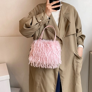 Pink plush chain crossbody bag for women featuring soft faux fur and elegant gold strap