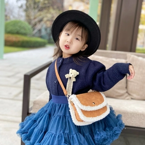 Kids fashion navy cardigan with blue tutu skirt and brown plush crossbody bag
