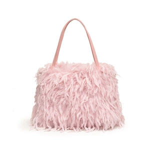 Pink faux fur handbag with leather handle and fluffy texture for women's crossbody wear