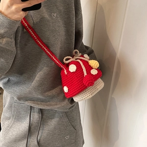 Handmade crochet mushroom drawstring crossbody bag with red polka dots for kids