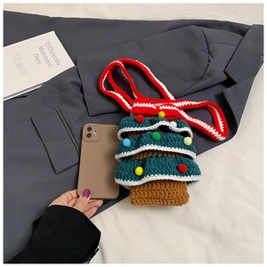 Detailed view of handmade crochet Christmas tree bag showing internal phone capacity