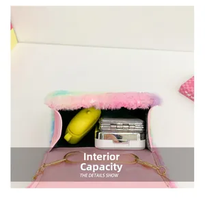 Detail showing the internal capacity of the rainbow plush girl's mini chain bag