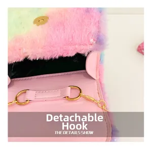 Detail of detachable gold metal hook on rainbow faux fur bag with pink leather lining