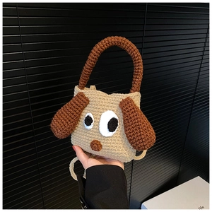 Detailed knit texture of a beige handmade cartoon dog shoulder bag with brown ears