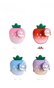 Four colors of cute strawberry-shaped kids backpacks with bunny details in a 2x2 grid view