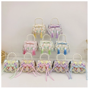 Collection of mini Chinese embroidery handbags with pearl handles and silk tassels