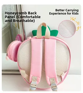 Detail of pink strawberry backpack featuring breathable honeycomb mesh back and padded straps