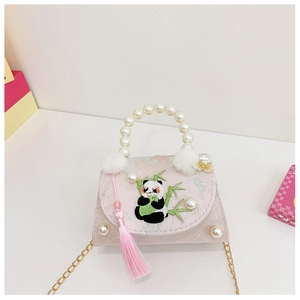 Close-up of pink girls handbag featuring panda embroidery and pearl handle detail