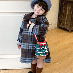 Kid check wool coat with double-breasted buttons and a crochet Christmas tree bag