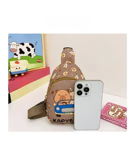Detail of Capybara print crossbody bag showing double zipper pockets and compact size