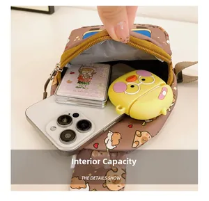 Detail view of the interior capacity showing a smartphone and accessories in the cute bag