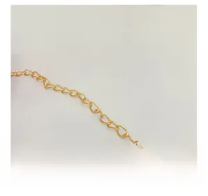 Detailed macro view showing the bright golden metal O-chain structure and smooth link texture