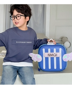 Detail of blue toddler hardshell backpack with sequined wings and NMQI letter print