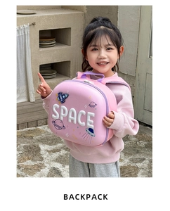 Detailed view of pink space-themed hardshell kids backpack with SPACE 3D embroidery