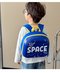 Detail of dark blue EVA hard shell kids backpack with space rocket and planet motifs