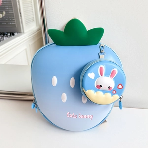 Detail of light blue strawberry backpack with matching cute bunny coin purse accessory