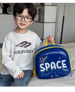 Detailed side view of cartoon space rocket hard shell kids backpack with SPACE typography
