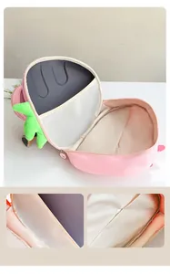 Detail of pink strawberry kids backpack showing large internal capacity and mesh pocket