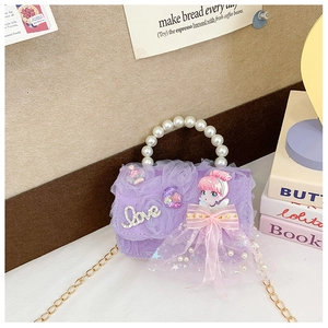 Detail of purple tulle children's bag with pearl handle and sequin cartoon girl